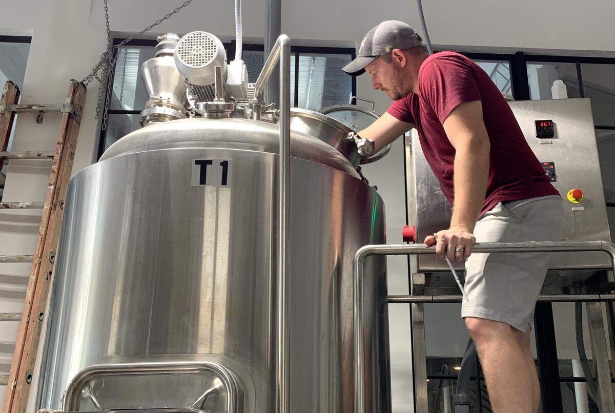 Beat Culture Brewery co-owner Erik Durr samples Iron Ale, a beer they made with ingredients from the Iron Beer soft drink.