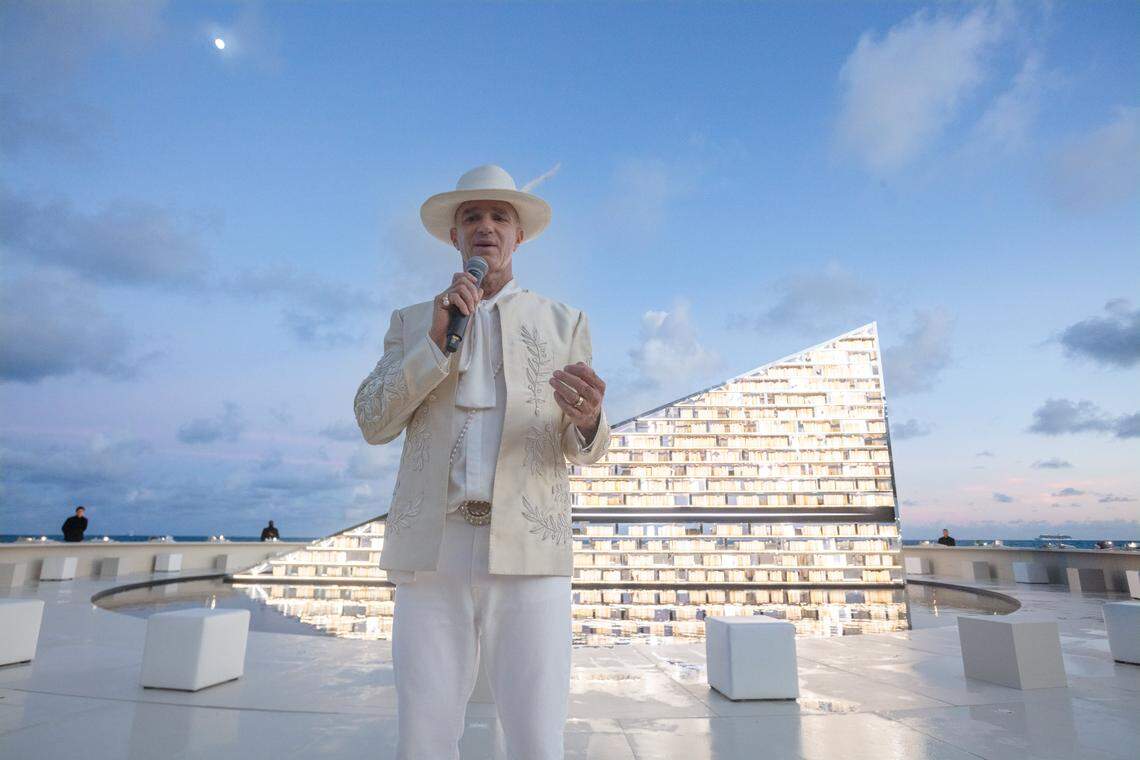 Miami Beach, Florida, December 1, 2025 - Alan Faena speaks in front of Es Devlin's kinetic sculpture titled Library of Us on the beach behind the Faena Hotel in Miami Beach, Florida. A luminous, participatory installation, The Library of Us by Es Devlin is a 50-foot-wide rotating triangular bookshelf containing 2,500 books that have shaped the artist's life and practice. The installation will be on display from December 2 thru Dec 7, 2025 behind the Faena Hotel in Miami Beach, Florida.