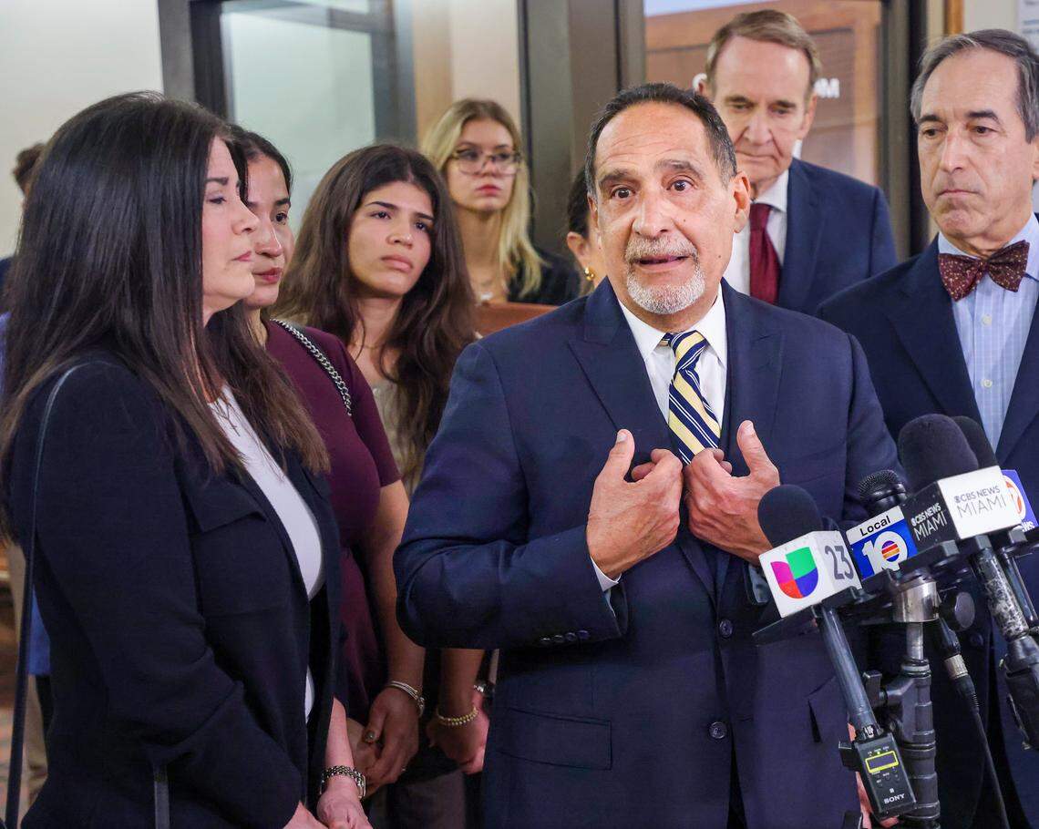 Surrounded by his lawyers, family, friends, and supporters, former Miami-Dade Commissioner Joe Martinez, center, explains why he could not take a plea deal after Judge Miguel de la O sentenced Martinez to a three-year prison sentence after being found guilty of public corruption on Monday, September 15, 2025, inside Courtroom 2-4 at the Richard E. Gerstein Justice Building in Miami, Florida.Martinez posted bail and will remain free while the appeals court rules that de la O may issue a sentence lower than what's in the sentencing guidelines.