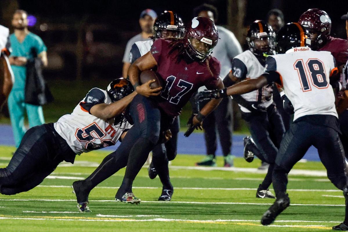 Miami Norland High’s quarterback Ennio Yapoor (17) carries the ball on a quarterback keep against Booker T. High in the first half at Traz Powell Stadium in Miami on Thursday, October 5, 2023.