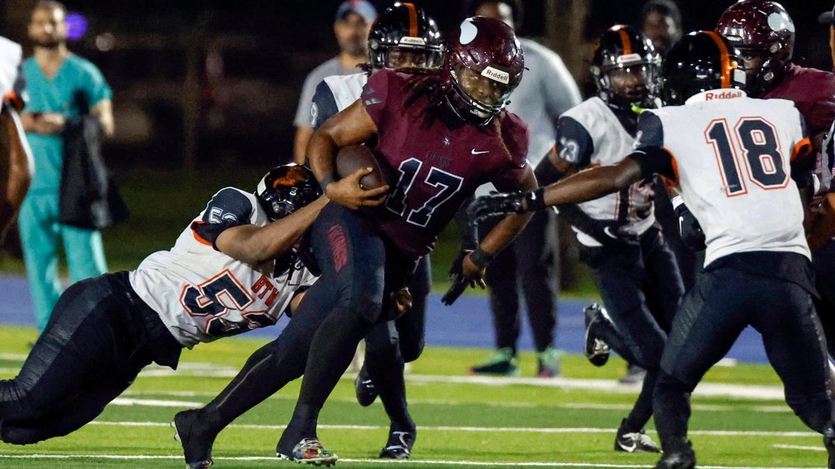 Miami Norland High’s quarterback Ennio Yapoor (17) carries the ball on a quarterback keep against Booker T. High in the first half at Traz Powell Stadium in Miami on Thursday, October 5, 2023.