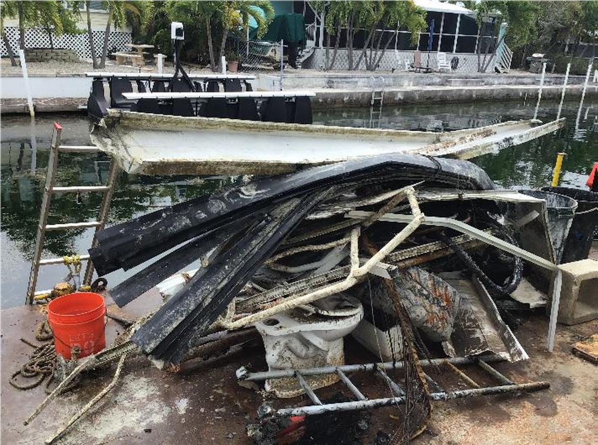 During the last week of canal marine debris removal, roofing materials and household items, like a toilet, were pulled from a Big Pine Key canal during the 2018-2019 post-Hurricane Irma canal cleaning project.