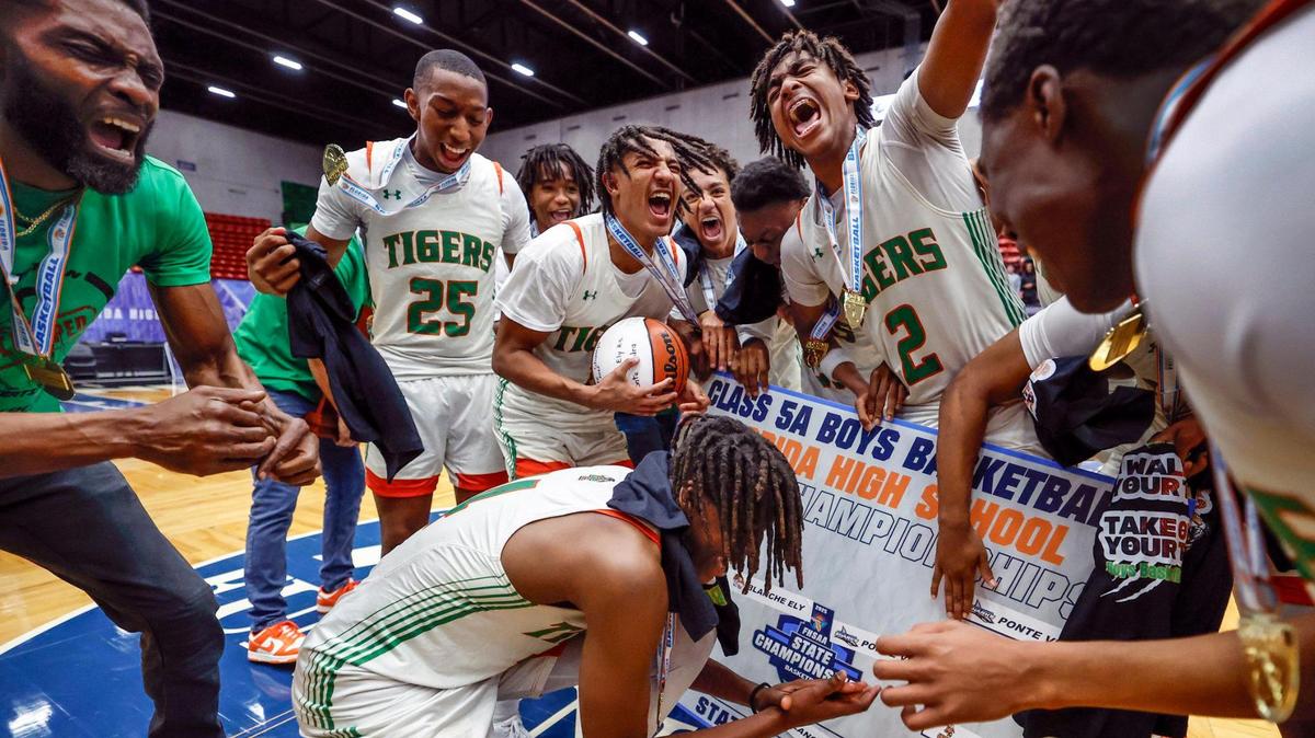 Blanche Ely Tigers celebrate on the court placing the school name on the final playoff bracket after defeating Ponte Vedra in the FHSAA Class 5A Final for Boys High School Basketball State Championship at the RP Funding Center in Lakeland, Florida on Friday, March 7, 2025.
