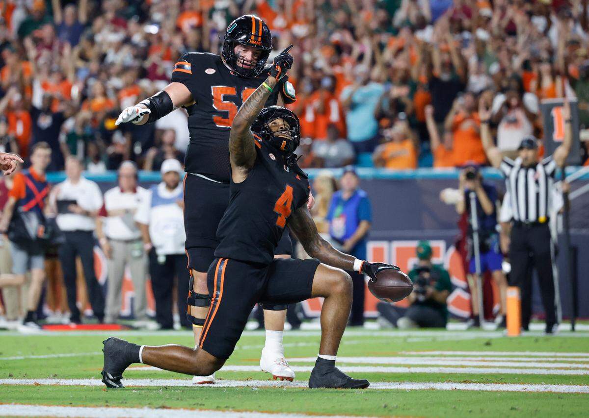 Miami Hurricanes running back Mark Fletcher Jr. (4) reacts after scoring against the Florida State Seminoles in the first half during an NCAA football game at Hard Rock Stadium in Miami Garden, Florida on Saturday, October 26, 2024. 
