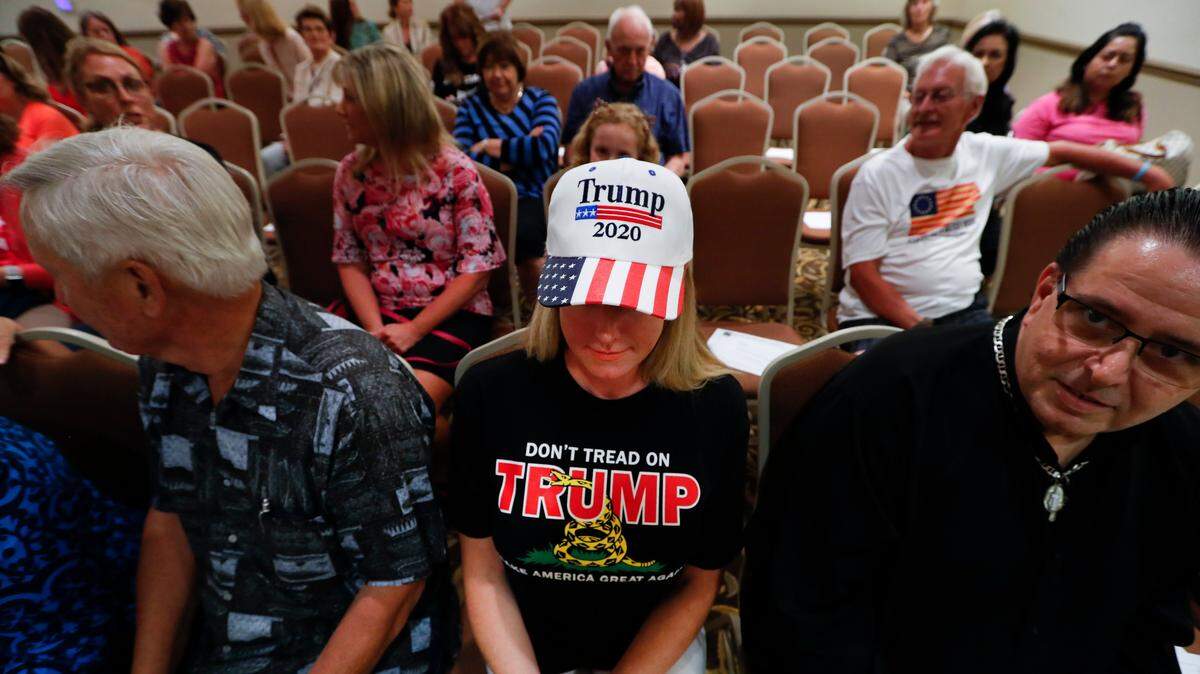 Lisa Mankiewicz sits in the audience during a training session for Women for Trump, An Evening to Empower, in Troy, Michigan, one of a series of sessions across the country on Thursday, as female surrogates and supporters fanned out across important battlegrounds in a high-profile push to make the president’s case on the economy and to train campaign volunteers.