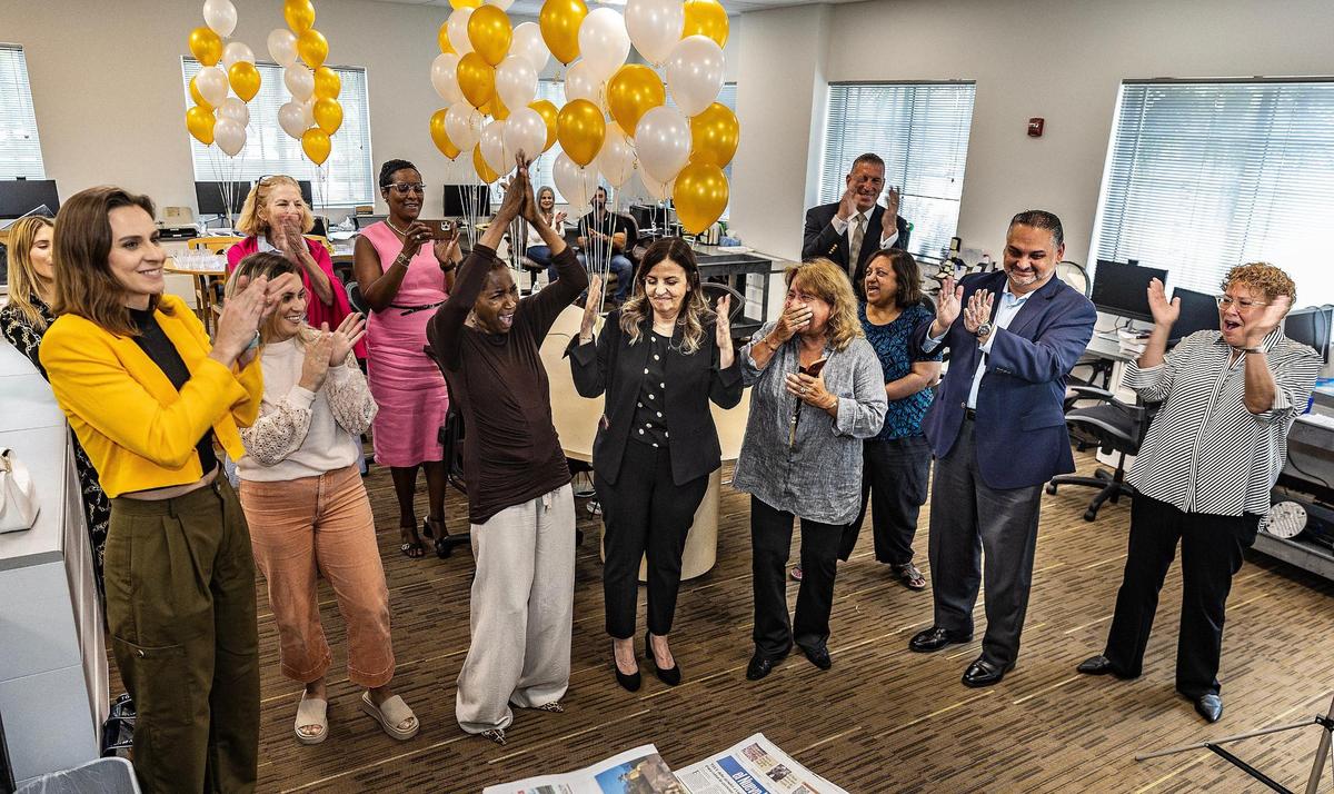 Members of the Miami Herald editorial board — including, in front row, from left: Isadora Rangel; Lauren Costantino, audience engagement producer; Nancy Ancrum, editorial page editor; Amy Driscoll, deputy editorial page editor; and Luisa Yanez editorial page; deputy managing editor react after winning the Pulitzer for editorial writing in May 2023.