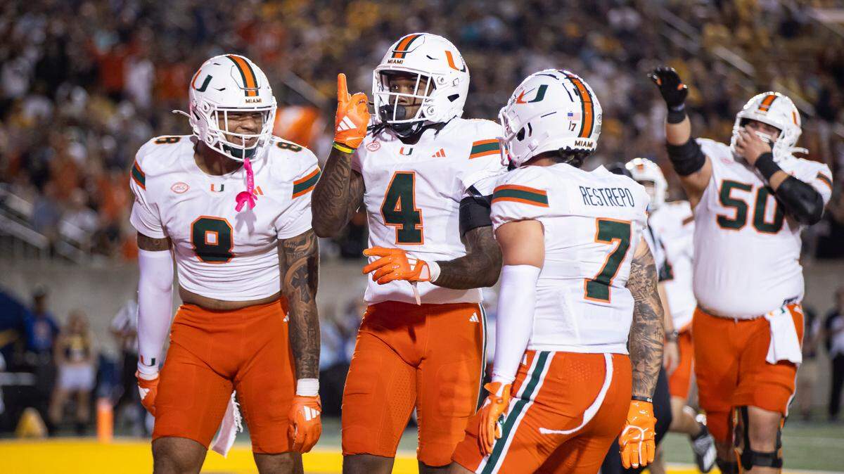 Miami Hurricanes running back Mark Fletcher Jr. (4) celebrates with his teammates after scoring against the California Golden Bears in the first half of their NCAA college football game at the California Memorial Stadium on Saturday, Oct. 5, 2024, in Berkeley, Calif.