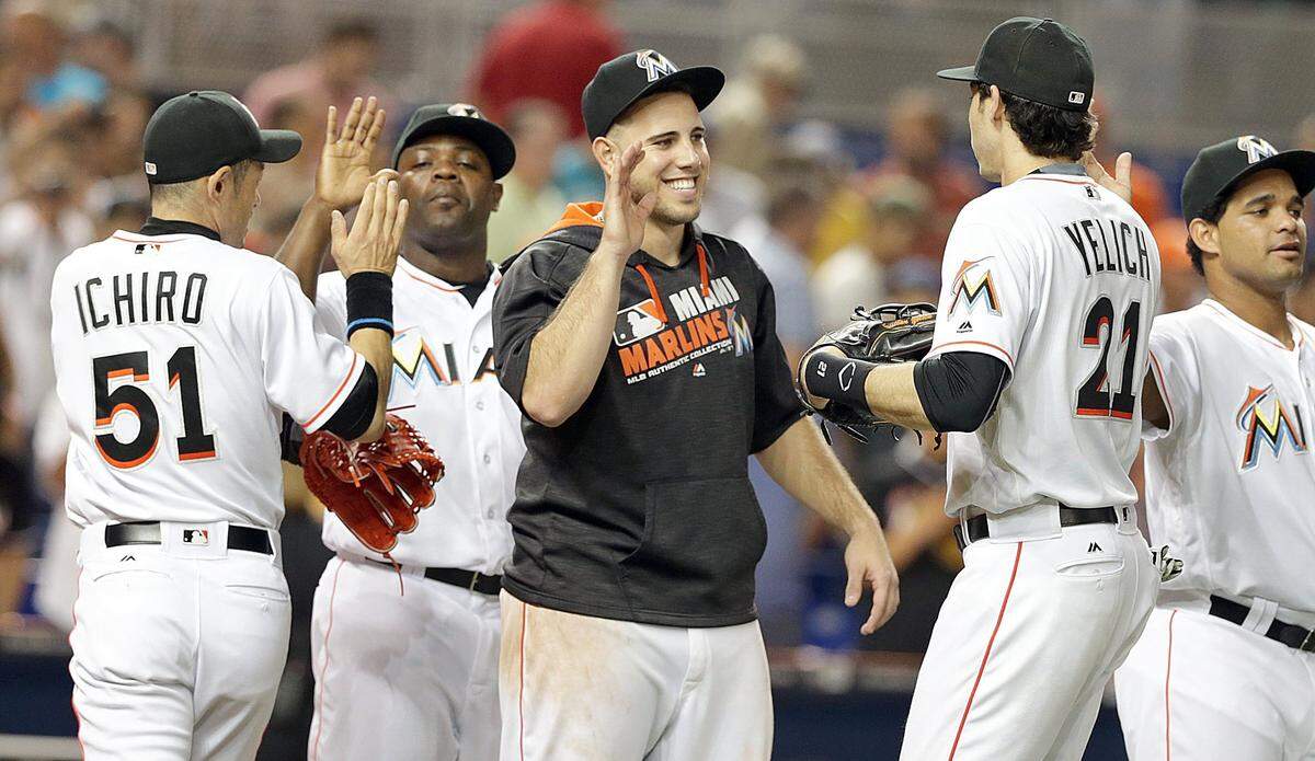 Miami Marlins’ Ichiro Suzuki, Fernando Rodney, Jose Fernandez and Christian Yelich celebrate their team’s 4-1 victory against the Los Angeles Dodgers at Marlins Park in Miami on Thursday, Sept. 9, 2016.