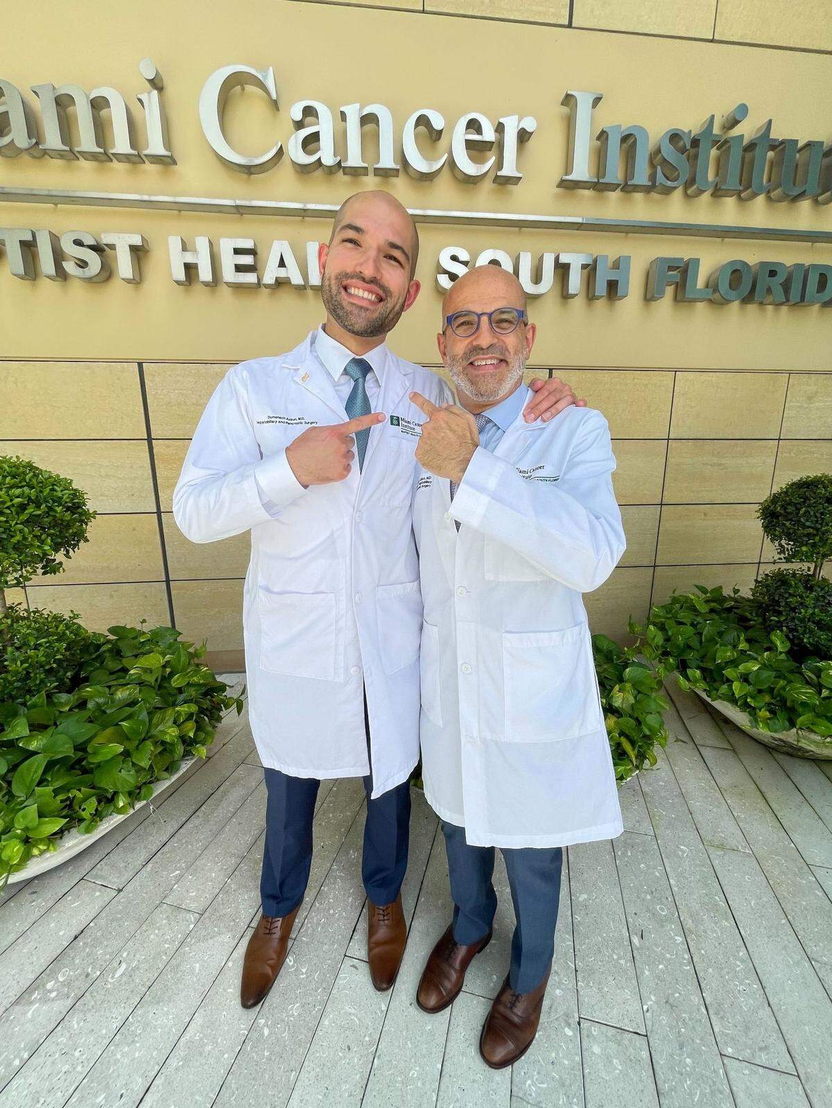 Domenech Asbun, left, and his father, Horacio Asbun, right, outside of Baptist Health South Florida.