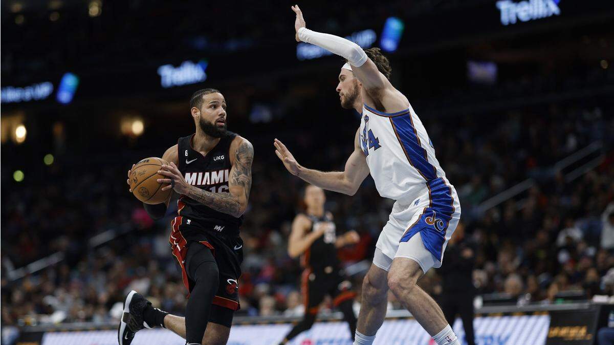 Miami Heat forward Caleb Martin (16) drives to the basket as Washington Wizards forward Corey Kispert (24) defends in the second quarter at Capital One Arena.