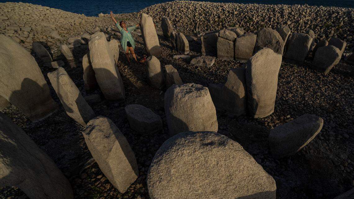 In Spain, the Valdecanas reservoir’s lake has shrunk in Europe’s historic drought, revealing an ancient site, the Dolman of Guadalperal or “Spanish Stonehenge.”