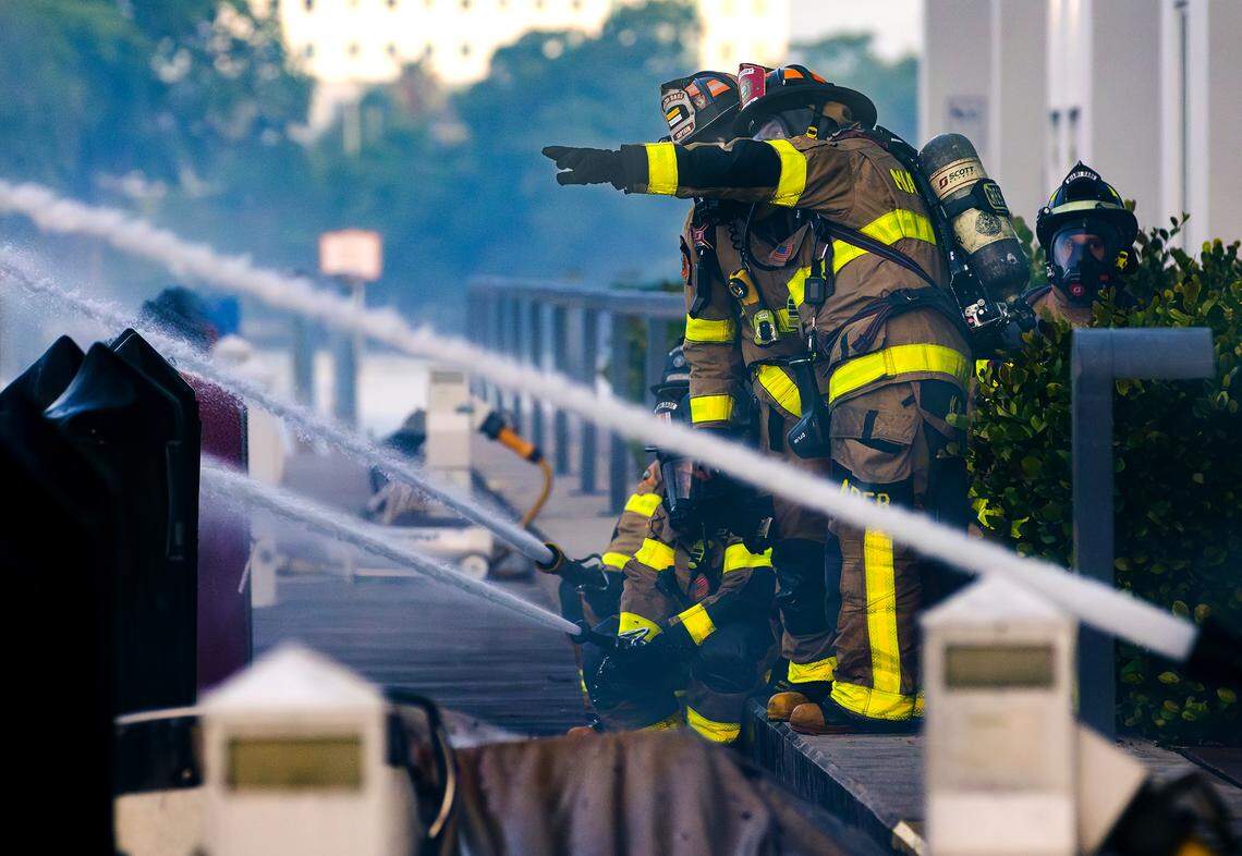 Miami-Dade Fire Rescue and Miami Fire Rescue crews respond to multiple boat fires early Friday, June 6, behind a high-rise condominium at 400 Sunny Isles Boulevard. The fire began in one boat and quickly spread to five others around the docks.