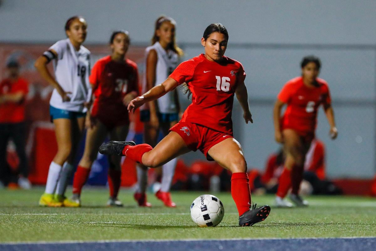 Doral Academy Katelyn Billoch (16) scores a penalty kick during the second half of a Region 4-7A quarterfinal playoff game against Coral Reef at Doral Academy High School in Doral, Florida on Tuesday, February 7, 2023.