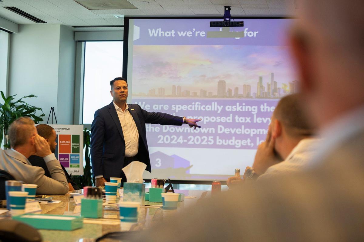James Torres, president of the Downtown Neighbors Alliance, talks during a Sunshine Meeting to argue against a tax increase on condo owners and businesses in Edgewater, Brickell, and downtown Miami.