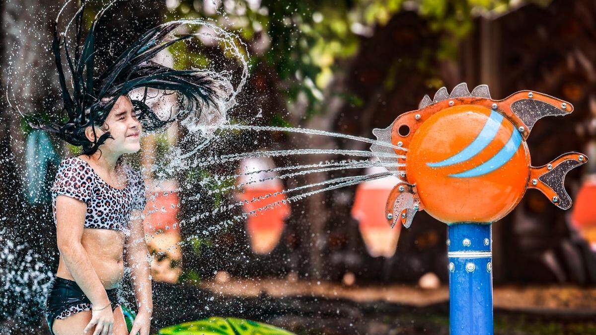 Key Biscayne Community Center visitor Martina Pastor, 7, enjoys the spray of water at the community splash pad as she cools off from the latest heat blast in Key Biscayne on Thursday, July 17, 2025.