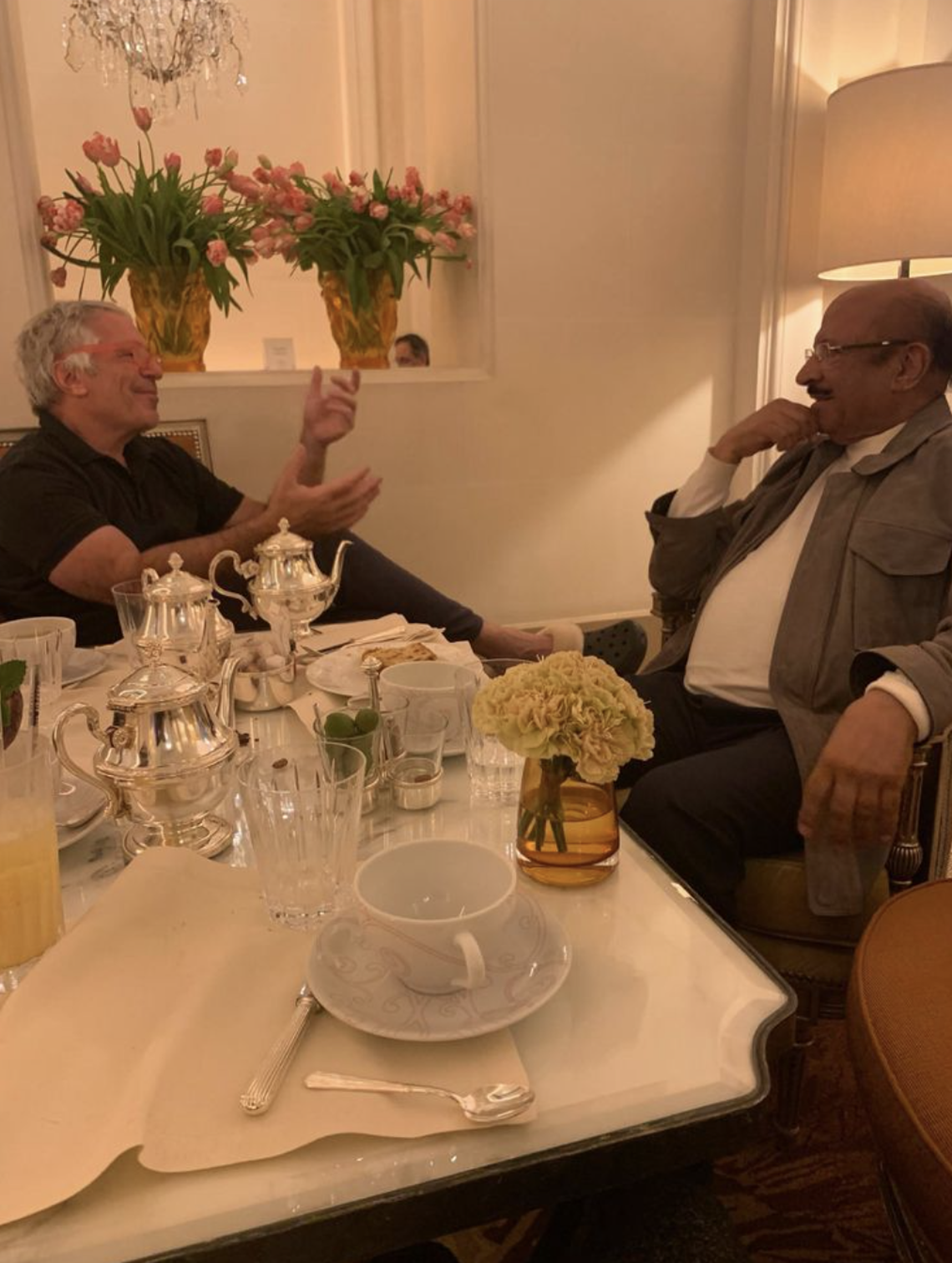 An undated photo released by the U.S. House Oversight Committee shows Jeffrey Epstein (L) in conversation with the late Yemeni billionaire Shaher Abdulhak (R).