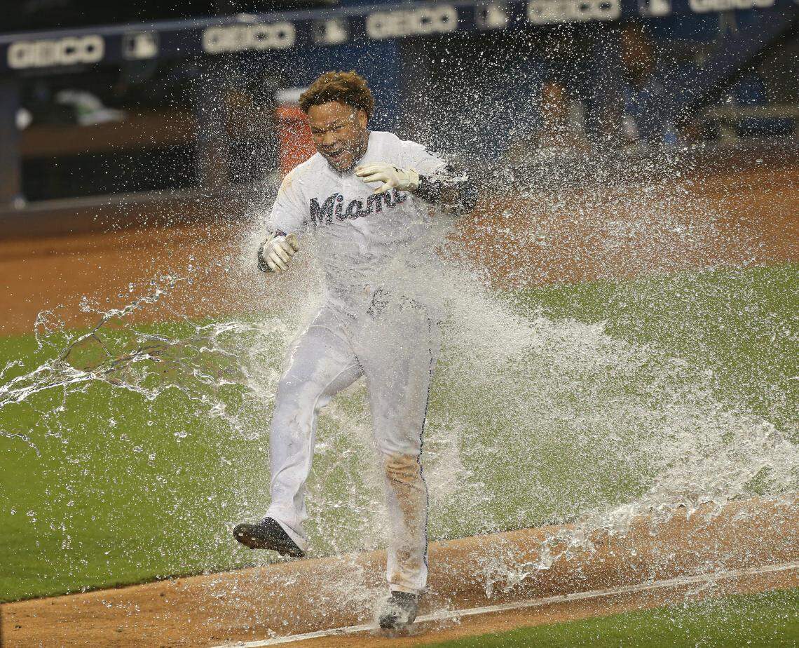 Miami Marlins left fielder Harold Ramirez (47) got dump with a cooler after hitting a solo walk-off home run during the twelve inning of a interleague Major League Baseball game at Marlins Park in Miami on Thursday, August 1, 2019. Marlins won 5-4.