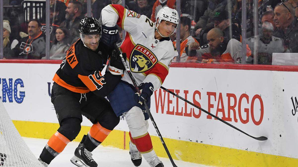 Jan 13, 2025; Philadelphia, Pennsylvania, USA; Florida Panthers defenseman Gustav Forsling (42) and Philadelphia Flyers right wing Garnet Hathaway (19) battle for the puck during the first period at Wells Fargo Center.