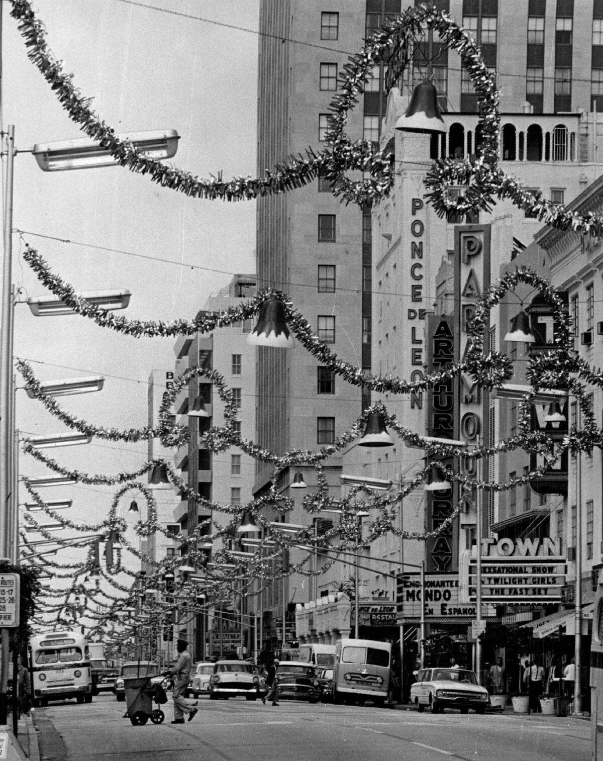 11/16/1963, Bill Kuenzel/Miami Herald Staff: Where’s Santa? How many shopping days to Christmas? Not many if you can believe what you see on Flagler St. these days. Pushing the season a bit - we haven’t arrived at the Thanksgiving milestone yet-Christmas decorations have added to the scenery in Miami’s bustling downtown area.