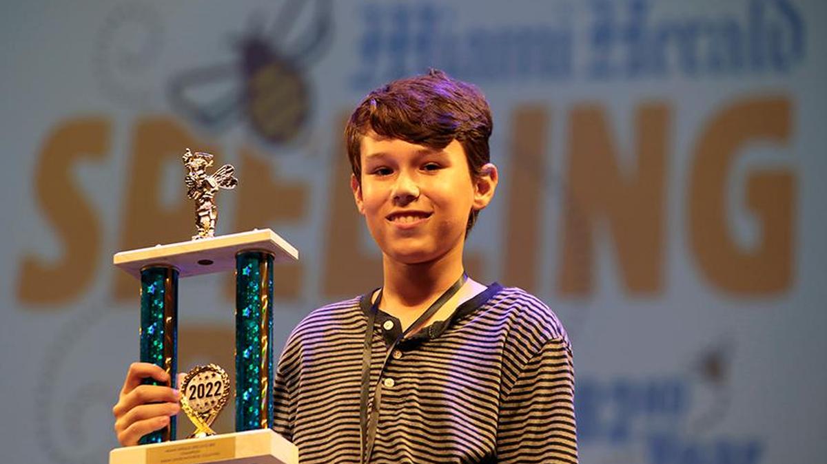 Miami Herald Spelling Bee winner Juan Cristóbal Rondeau, 13, a seventh-grader at Westminster Christian School, with his trophy at the Charles F. Dodge City Center, Pembroke Pines, on Thursday, March 17. He won the Bee, which featured 24 elementary and middle school students in Miami-Dade and Monroe counties. He will compete in the 2022 Scripps National Spelling Bee at the end of May.