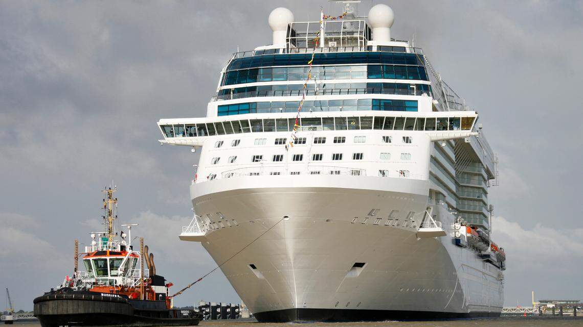 In this file photo, a tugboat is seen in front of the cruiser Celebrity Equinox in 2009.