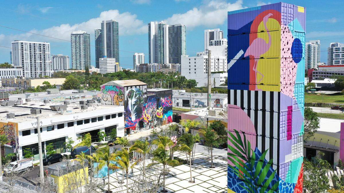 The Tower Bar rises above The Oasis outdoor venue in Wynwood facing the restaurants, which are located in shipping containers (note the yellow and blue containers at left). There’s also a bar at the bottom of the Tower.