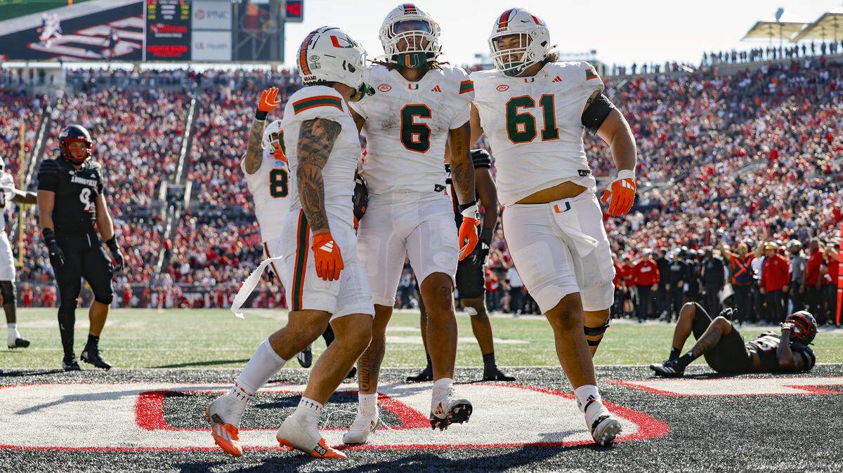 Miami Hurricanes running back Damien Martinez (6) celebrates with teammates after scoring against the Louisville Cardinals in the second half during an NCAA football game at L&N Federal Credit Union Stadium in Louisville, Kentucky on Saturday, October 19, 2024.