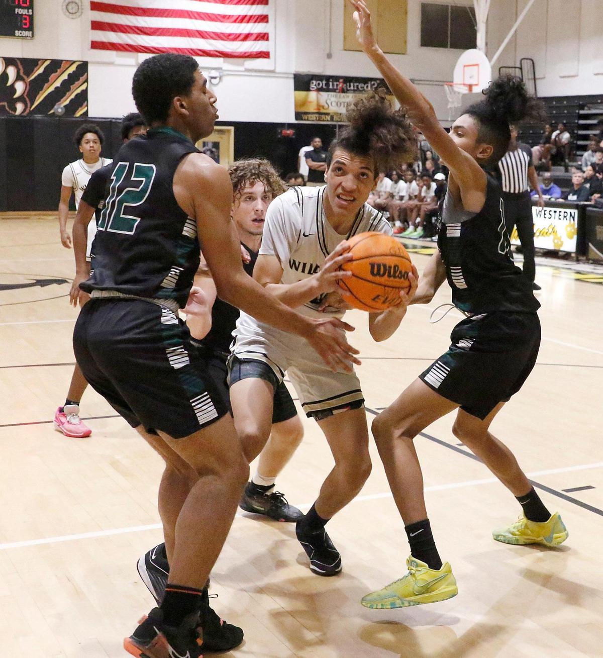 Western Wildcats Gabe Osorio (20) attempts shoots against Hialeah Gardens Gladiators during Region 4-7A boys basketball quarterfinal game on Thursday, February 15, 2024 at Western HS in Davie.