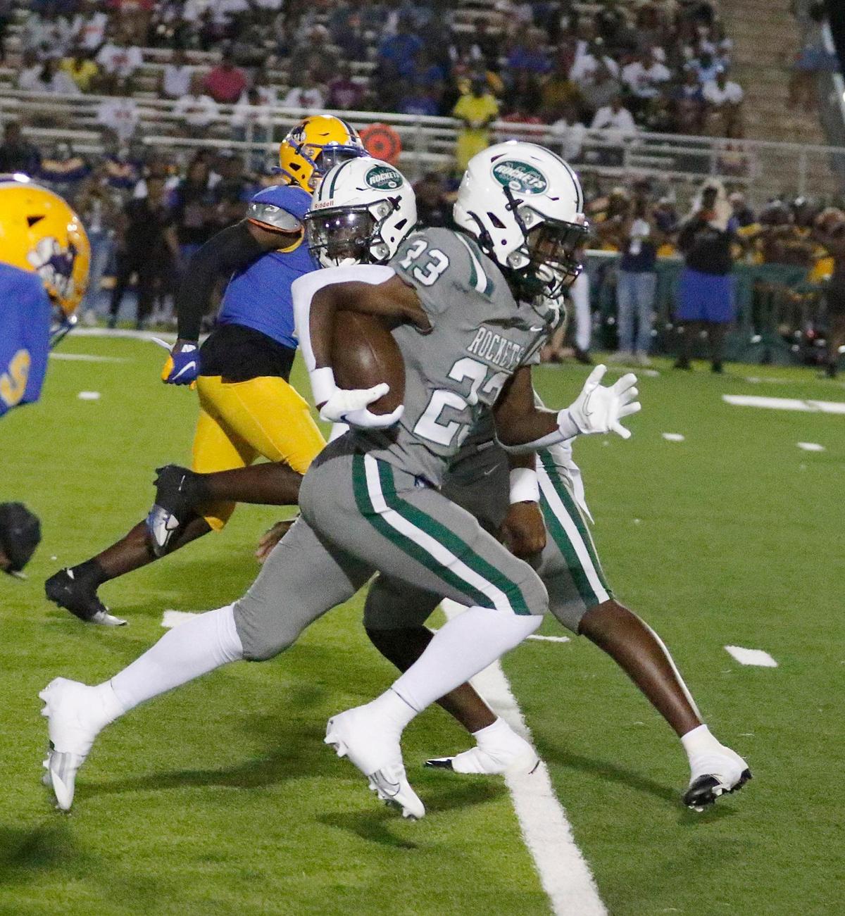Miami Central Rockets running back Omarian Williams (23) gains yardage against Northwestern Bulls during football game on Friday, October 7, 2022 at Traz Powell Stadium in Miami. Andrew Uloza / for Miami Herald