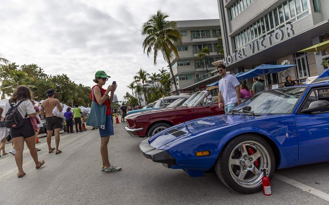 People make their way past a 1974 Detomaso Pantera on display at the Classic Car Show during Art Deco Weekend at Ocean Drive on Saturday, Jan. 10, 2026, in Miami Beach, Fla.