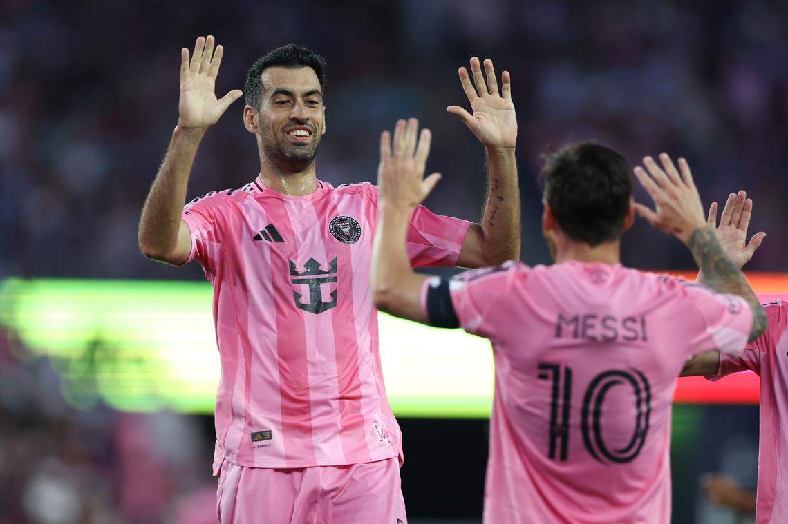 Jul 9, 2025; Foxborough, Massachusetts, USA; Inter Miami CF midfielder Sergio Busquets (5) celebrates with Inter Miami CF forward Lionel Messi (10) during the first half against the New England Revolution at Gillette Stadium. Mandatory Credit: Paul Rutherford-Imagn Images