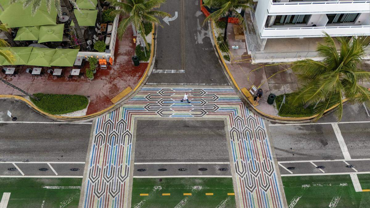 “The Rainbow Crosswalk” designed by Savino Miller studio, is made from terrazzo pavers, arranged in an Art Deco pattern at the intersection of Ocean Drive and 12th Street in the Historic Art Deco District of Miami Beach, Florida and seen here on Friday, September 12, 2025.