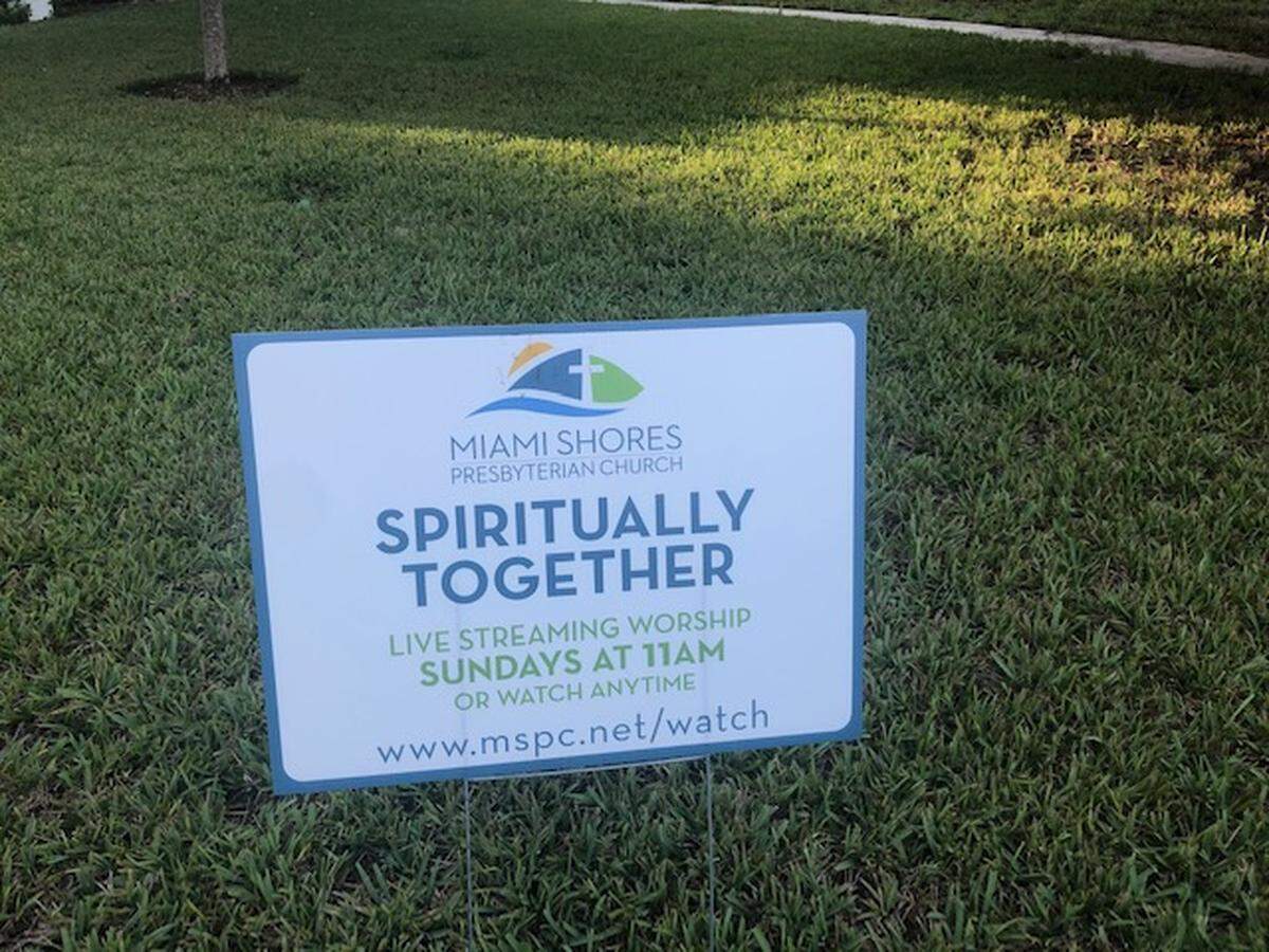 A yard sign in Miami Shores promotes online services.