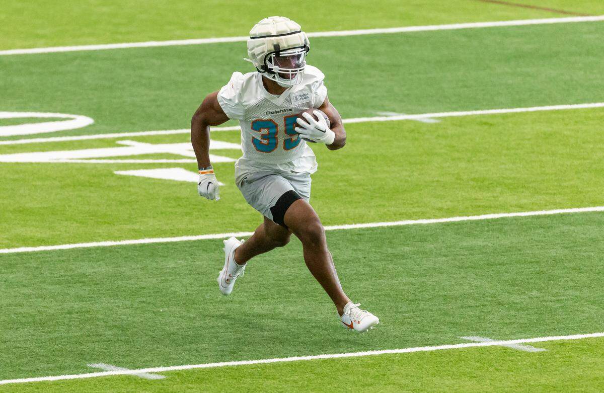 Miami Dolphins running back Chris Brooks (35) runs with the ball during team practice at the Baptist Health Training Complex on Wednesday, Sept. 6, 2023 in Miami Gardens, Fla.