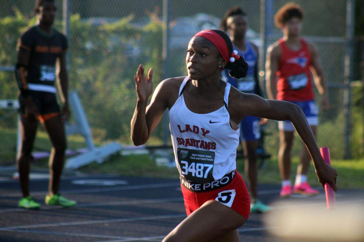 Meara Rasul (3487) of Miami Southridge rounds the corner in the girls 4x100-meter relay during the FHSAA Class 4A high school track and field championship in Jacksonville on May 20, 2023. [Clayton Freeman/Florida Times-Union]