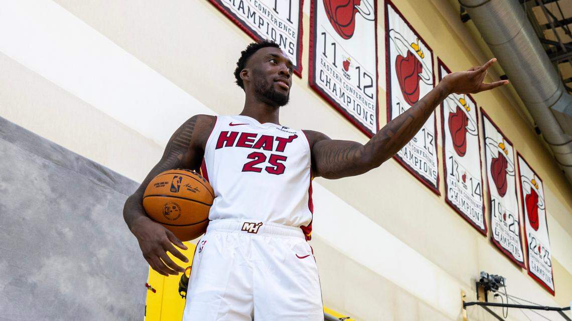 Miami Heat forward Nassir Little (25) shoots fake spider webs as he strikes a pose during media day at Kaseya on Monday, September 30, 2024, in Miami, Fla.