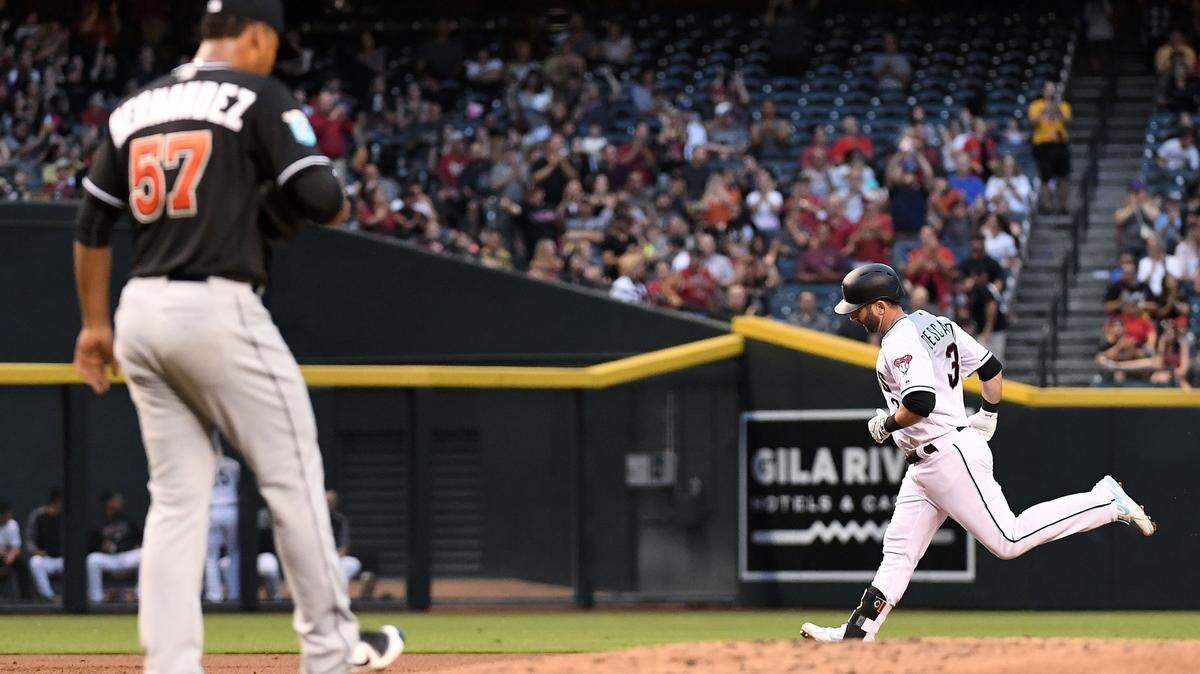 PHOENIX, AZ - JUNE 01:  Daniel Descalso #3 of the Arizona Diamondbacks hits a two-run home run off Elieser Hernandez #57 of the Miami Marlins in the second inning of the MLB game at Chase Field on June 1, 2018 in Phoenix, Arizona.  (Photo by Jennifer Stewart/Getty Images)