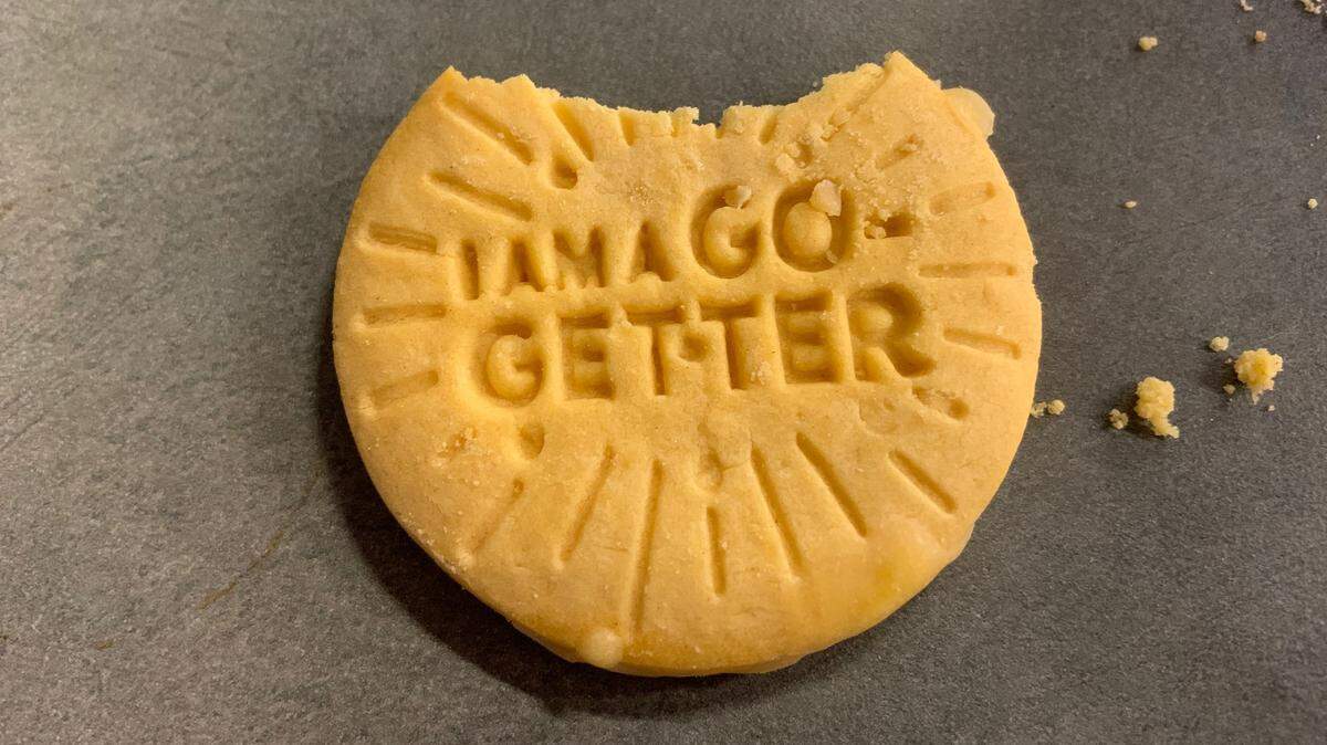 One of the new Lemon-Ups flavor Girl Scout Cookies (with one bite removed)