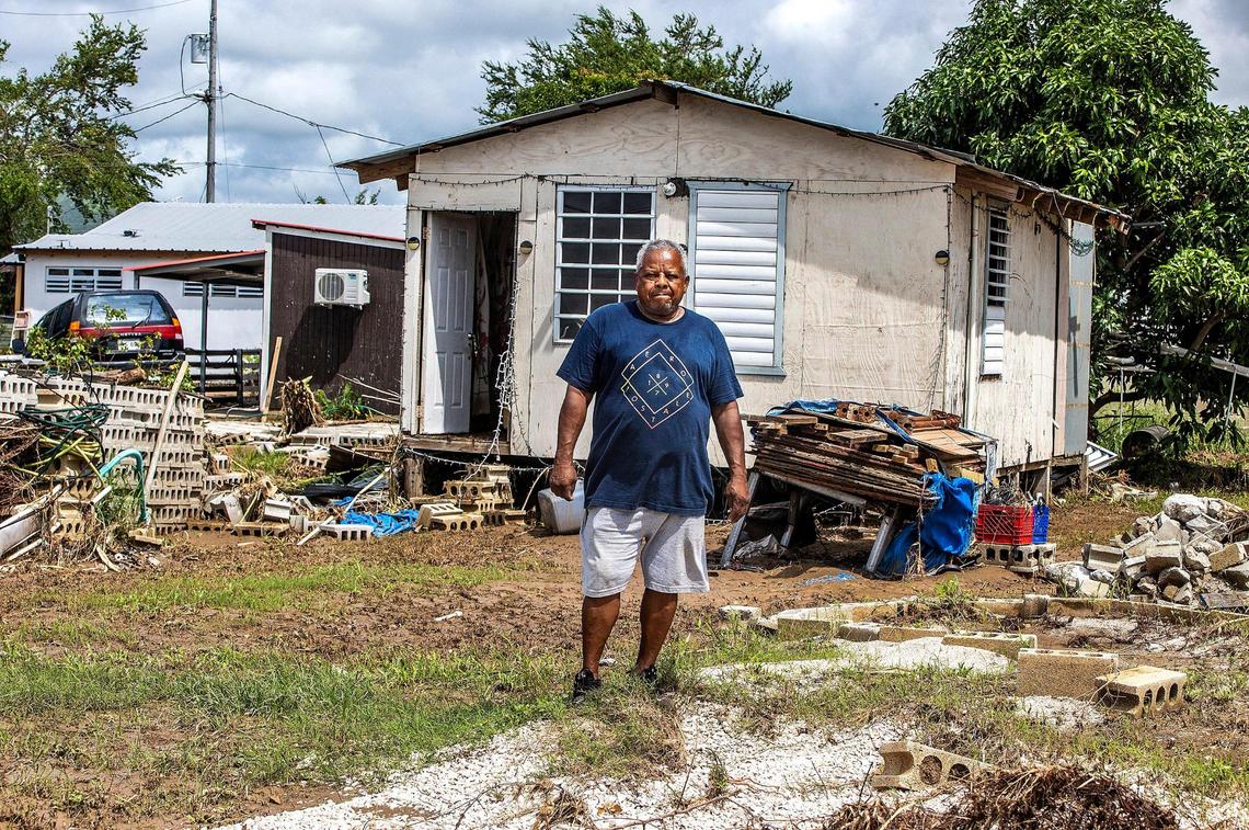 Gilberto Pacheco Padilla, 65, stands in front of his wrecked wooden house after Hurricane Fiona flooded Villa Esperanza in Salinas, Puerto Rico, on Friday Sept. 23, 2022.