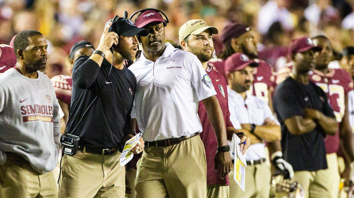 Florida State head coach Willie Taggart, right, talks with offensive coordinator Kendal Briles in the second half of an NCAA college football game in Tallahassee, Fla., Saturday, Sept. 28, 2019. Florida State defeated North Carolina State 31-13.