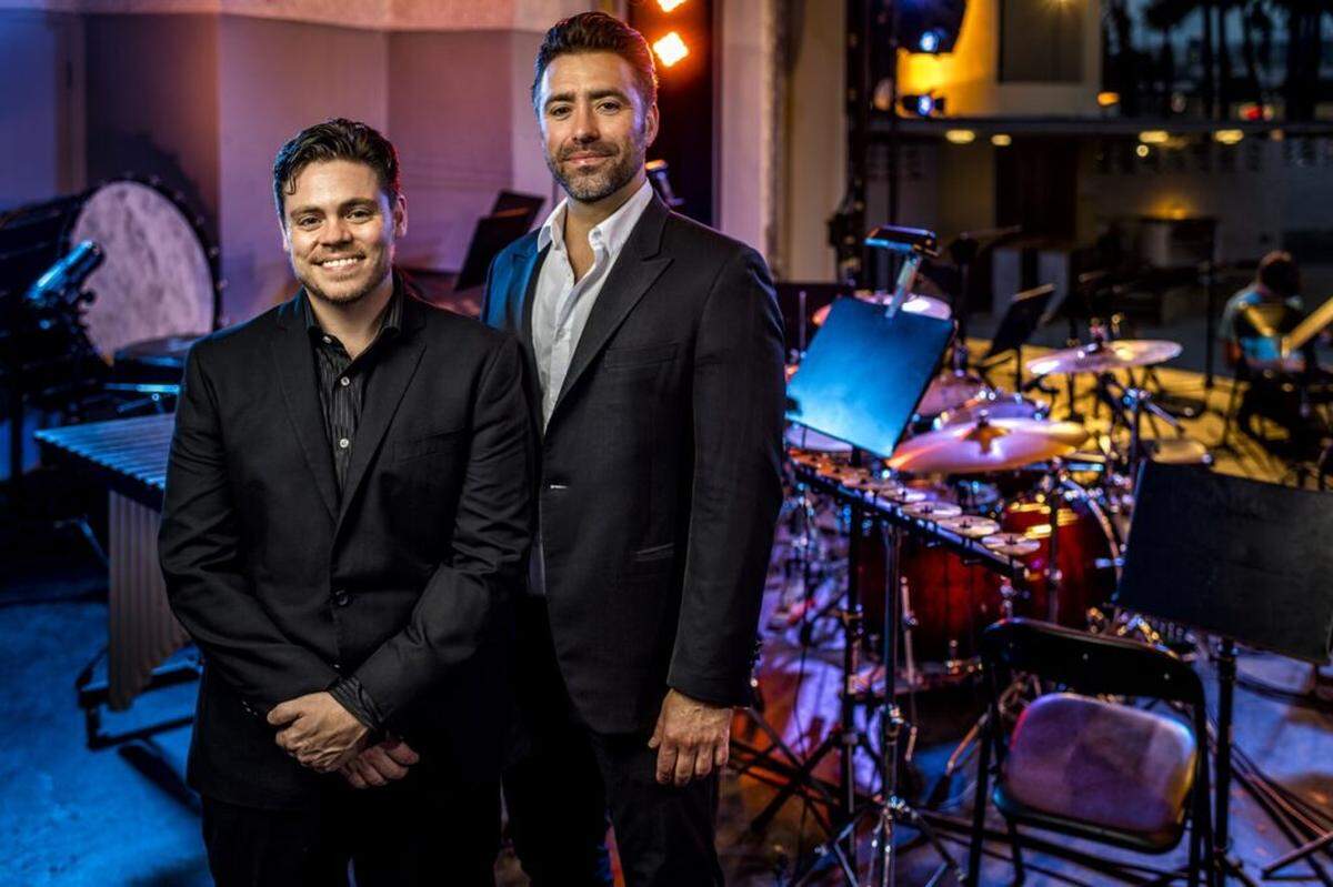 The idea behind Nu Deco Ensemble, conceived by composer-arranger Sam Hyken, left, and conductor Jacomo Bairos, right, was to create a 21st-century orchestra.