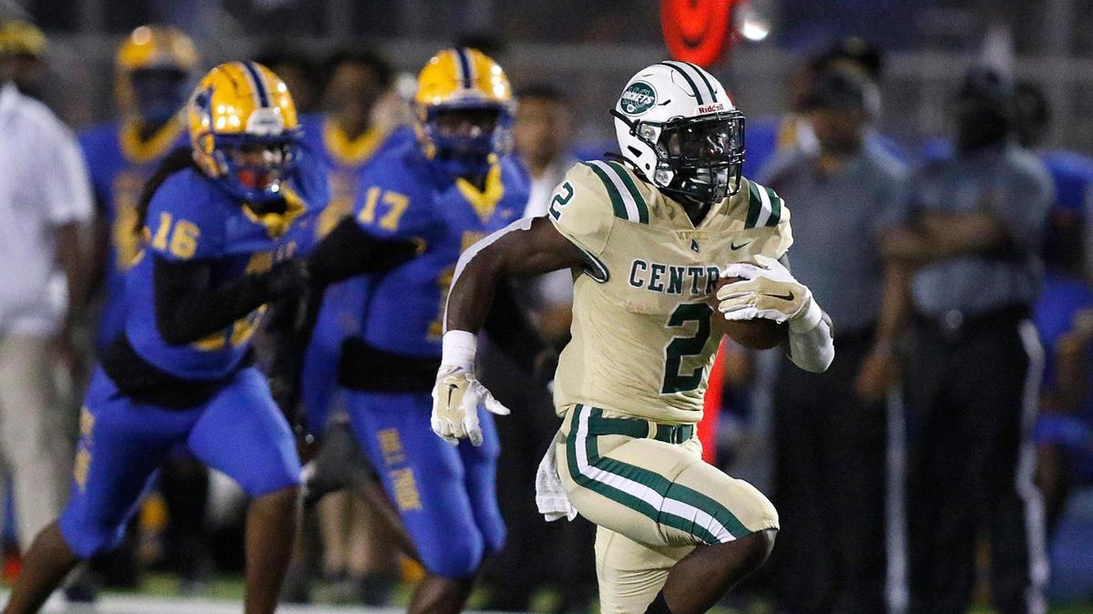 Miami Central Rockets running back Ghana Oboh (2) gains yardage against Northwestern Bulls during football game Thursday, October 28, 2021 at Traz Powell Stadium in Miami.