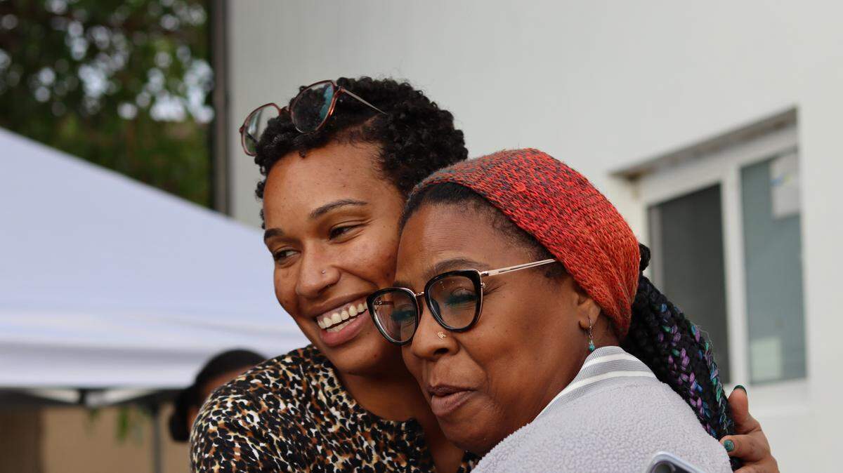 Nayshma Jones, director of the CLEO Institute’s Empowering Resilient Women program, embraces one of the cohort members as she arrives.