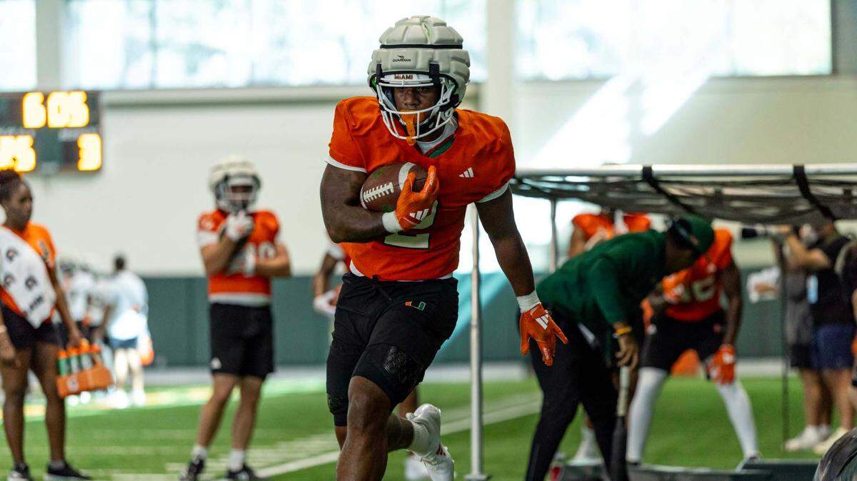Miami Hurricanes running back Jordan Lyle (2) carries the ball as he runs through a drill during spring practice at the Carol Soffer Indoor Practice Facility at the University of Miami on Wednesday, March 5, 2025, in Coral Gables, Florida.