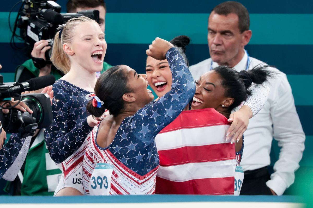 From left, Team USA’s Jade Carey, Jordan Chiles, Suni Lee and Simone Biles celebrate during the women’s gymnastics team final at Bercy Arena in Paris on Tuesday. (Wally Skalij/Los Angeles Times/TNS)