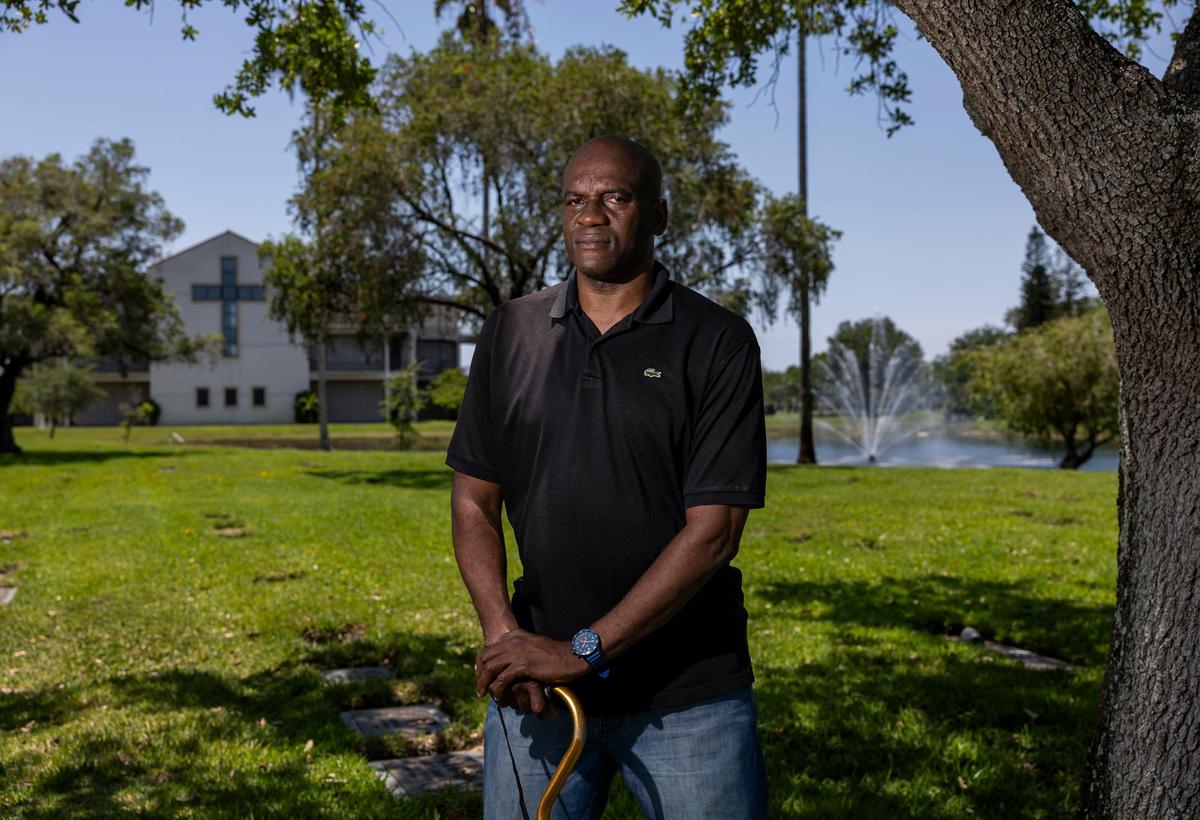 Augustin Lorfils, 53, visits Our Lady of Mercy Catholic Cemetery on Friday, May 10, 2024, in Doral, Fla. Lorfils’ mother and five siblings, who died after being thrown overboard, are buried at the cemetery and he is now working to place headstones at their grave site.
