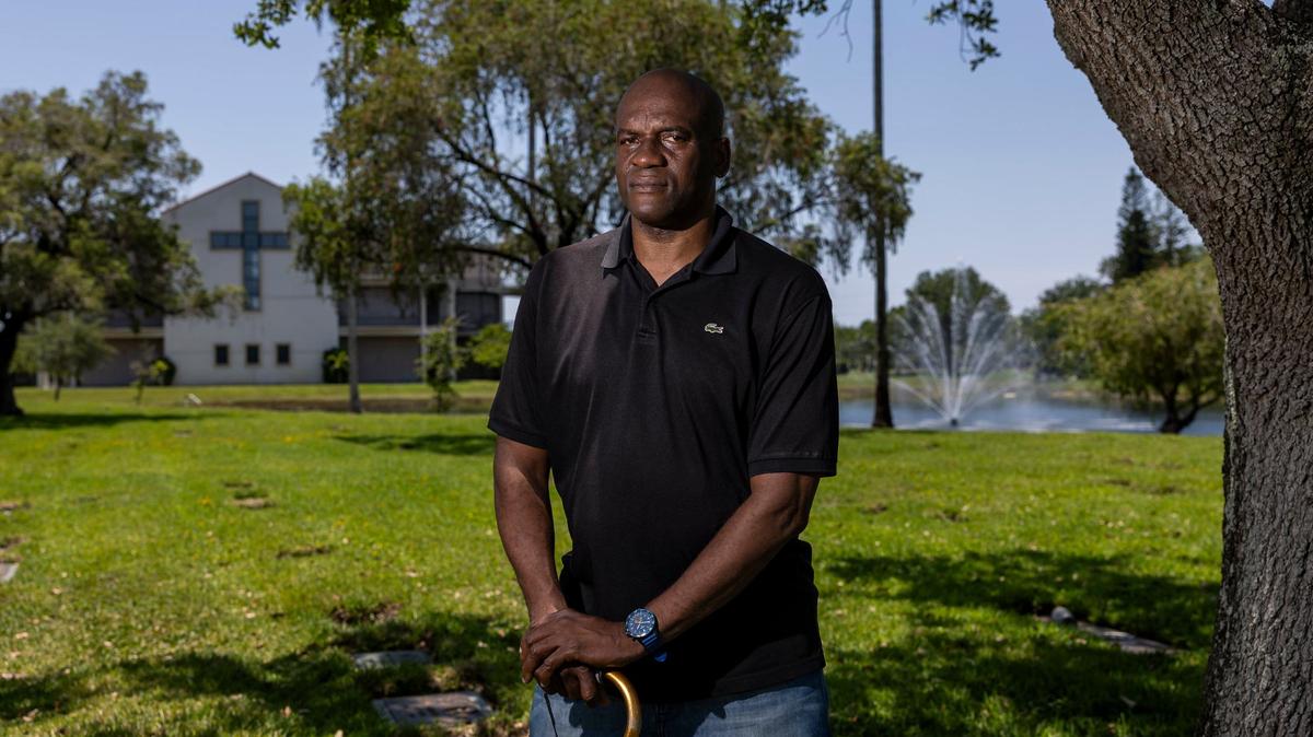 Augustin Lorfils, 53, visits Our Lady of Mercy Catholic Cemetery on Friday, May 10, 2024, in Doral, Fla. Lorfils’ mother and five siblings, who died after being thrown overboard, are buried at the cemetery and he is now working to place headstones at their grave site.