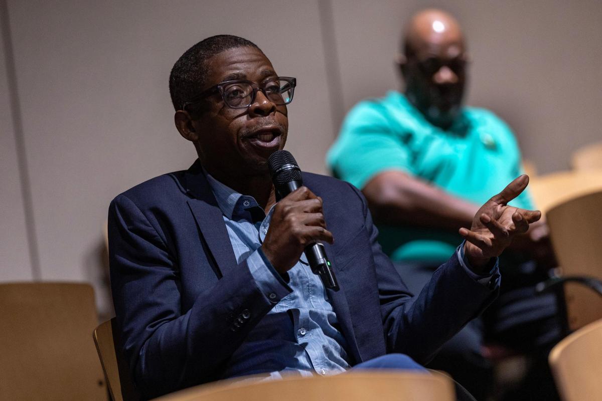 Francis Francis asks the speakers a question during the Out of Many, One Community: Combating Anti-Immigrant Rhetoric panel discussion hosted by South Florida People of Color at the African-American Cultural Research Center on Thursday, October 17, 2024, in Miami, Fla.