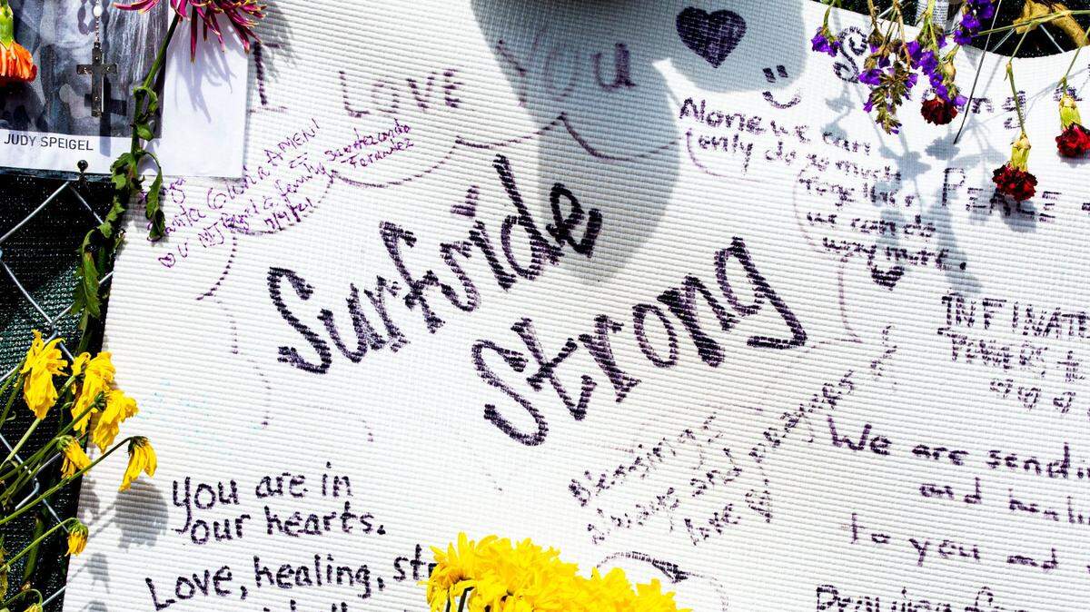 Signs of encouragement at the makeshift memorial site made for the victims lost in the rubble of the Champlain Towers South collapse, one day after a shift from search-and-rescue to recovery of victims’ remains, in Surfside, Florida, on July 8, 2021.