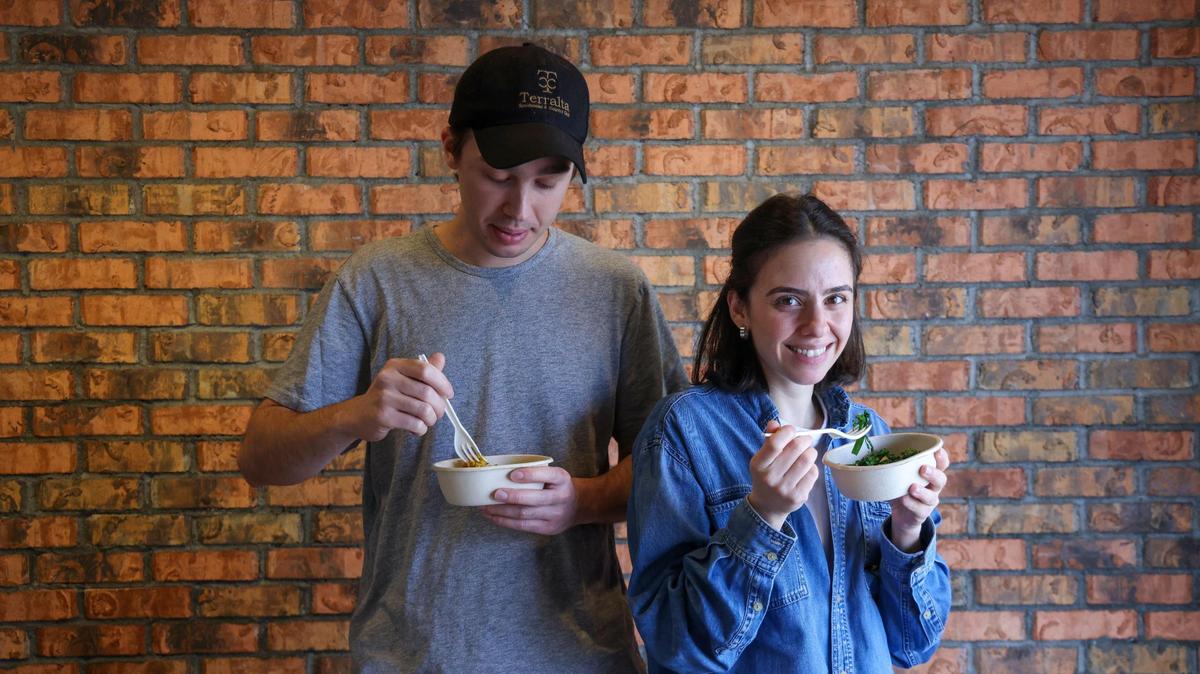 Husband and wife team Cem and Ece Kinay sample the meals prepared by their robot chef. “I can eat here every day,” Ece Kinay said.